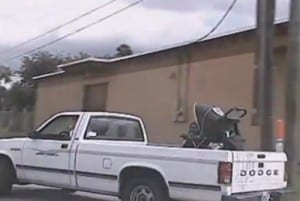 Keyona Davis with stroller in back of truck