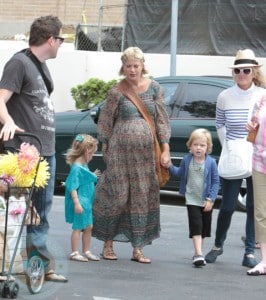 A pregnant Tori Spelling with Bill Horn and kids Liam and Stella