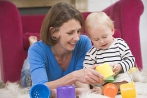 mom stacking toys with her toddler