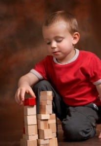 Boy stacking blocks (stock photo)