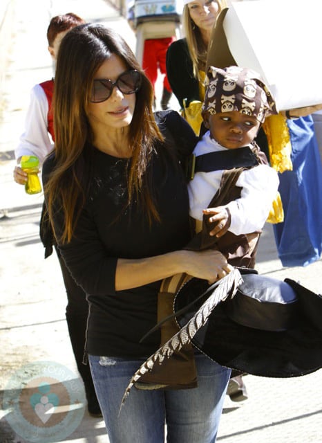 Sandra Bullock and Louis dressed as Pirates for a party