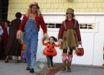 Alyson Hannigan, Alexis Densiof and daughter Satyana go trick or treating