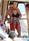 David Furnish and son Zachary on the beach in Hawaii