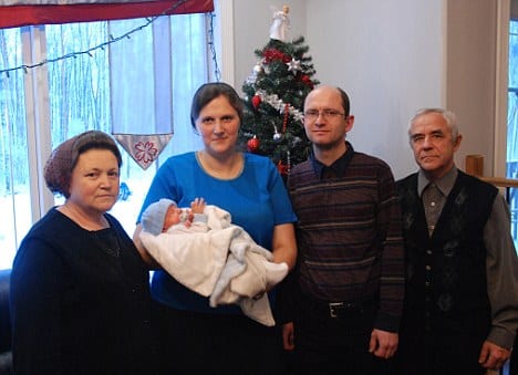 Heinrich and Tatjana Urich hold their two-week old son, Henry