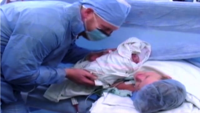 Kelly Davis with Hayes after birth
