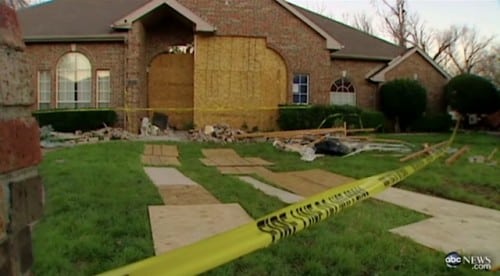 Car Crashes Through House