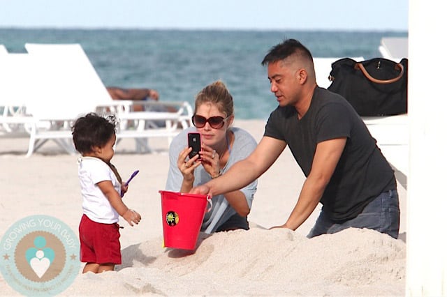 Doutzen Kroes & her son Phyllon at the beach in Miami