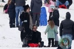 Tim Burton and Helena Bonham Carter play in the snow with their kids