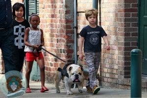Shiloh, MAddox and Zahara walk the dog in New Orleans