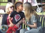 heidi Klum giving son Johan a kidd at the park