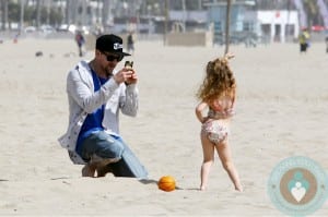 Joel Madden with daughter Harlow at the beach