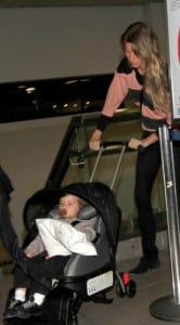 Benjamin brady in car seat at the airport with mom Gisele