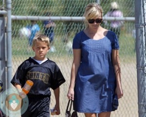 pregnant Reese Witherspoon with son Deacon at football game