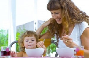 Mom and daughter eating cereal