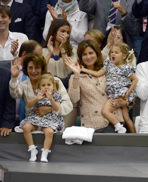 Mirka Federer watches husband Roger Federer with her twin daughters Myla Rose and Charlene Riva