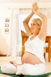 pregnant woman doing yoga