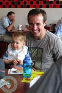 DRew Brees with son Bowen in NOrleans