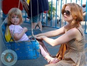 Isla Fisher with daughter Elula at a petting zoo