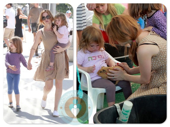 Isla Fisher with daughters Elula and Olive at a petting zoo