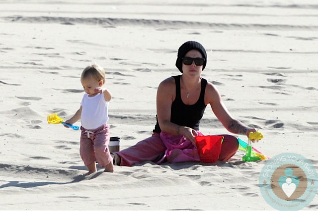 Pink plays with her daughter Willow at the beach