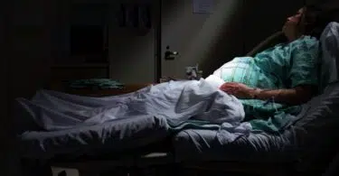 pregnant woman laying in hospital bed