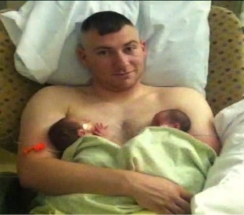 Andy Adams with two of his quadruplets