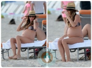 A Very pregnant Gisele Bundchen sunbathing in Miami