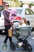 Alyson Hannigan has her hands full as she takes her daughters Satyana and Keeva out for lunch in Los Angeles