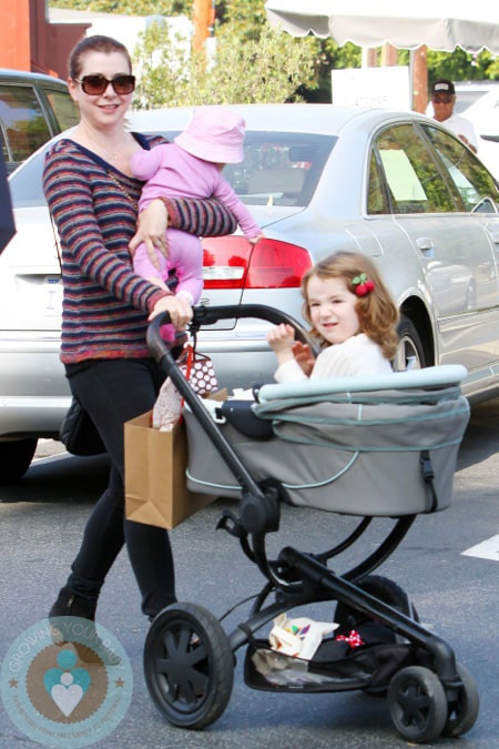 Alyson Hannigan has her hands full as she takes her daughters Satyana and Keeva out for lunch in Los Angeles