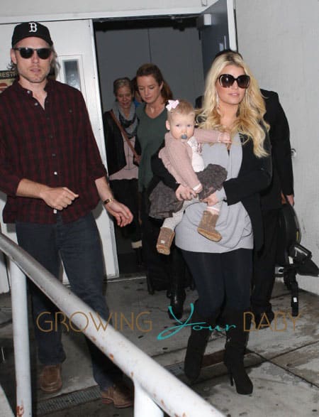 A Pregnant Jessica Simpson Arriving On A Flight At LAX With Her Family