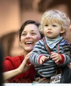 Marion Cotillard and son Marcel cheer for partner Guillaume Canet as he competes in the Gucci Paris Masters Show Jumping event