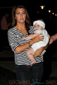 Kourtney Kardashian holds daughter Penelope close as she heads into Serendipity's in Miami to celebrate her son Mason's third birthday