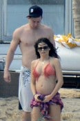 **EXCLUSIVE** Jenna Dewan shows off her blossoming baby bump in a bikini top as she frolics on the beach with husband Channing Tatum