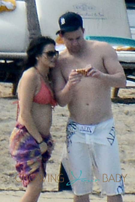 **EXCLUSIVE** Jenna Dewan shows off her blossoming baby bump in a bikini top as she frolics on the beach with husband Channing Tatum