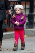 Jessica Parker's twin daughters Tabitha and Loretta Broderick wear colorful coats as they walk to school with their babysitter