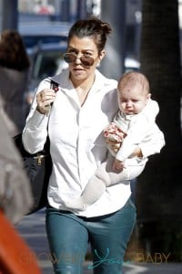 Kourtney Kardashian carries her baby daughter Penelope while shopping in Beverly Hills