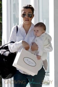 Kourtney Kardashian carries her baby daughter Penelope while shopping in Beverly Hills