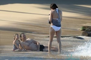 Milla Jovovich spotted on the beach in a bikini on New Years Eve in Maui, Hawaii