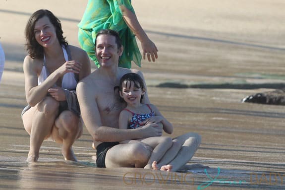 Milla Jovovich spotted on the beach in a bikini on New Years Eve in Maui, Hawaii