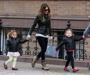 Actress Sarah Jessica Parker forms a train with her twin daughters, Marion and Tabitha Broderick, as they walk to school in West Village in New York City