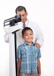 doctor measuring boy