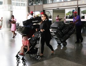 Heavily pregnant Coleen Rooney and family are spotted at Barbados airport shortly after arriving on a fight from the UK