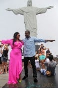 Pregnant reality TV star Kim Kardashian wears a pink dress while her and boyfriend rapper Kanye West visit the Christ the Redeemer statue in Rio De Janeiro