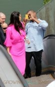 Pregnant reality TV star Kim Kardashian wears a pink dress while her and boyfriend rapper Kanye West visit the Christ the Redeemer statue in Rio De Janeiro