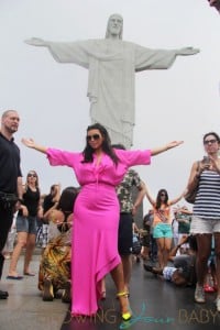 Pregnant reality TV star Kim Kardashian wears a pink dress while her and boyfriend rapper Kanye West visit the Christ the Redeemer statue in Rio De Janeiro