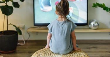 little girl watching television