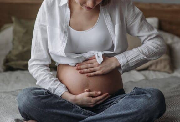A Pregnant Woman Holding Her Baby Bump