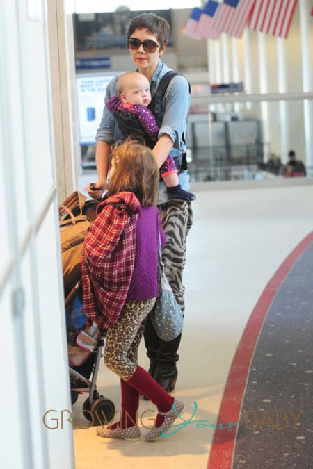 Maggie Gyllenhaal has her hands full as she carts her kids and luggage through LAX in Los Angeles