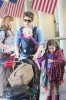 Maggie Gyllenhaal has her hands full as she carts her kids and luggage through LAX in Los Angeles