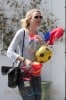 Naomi Watts has her hands full with toys while out shopping in Los Angeles